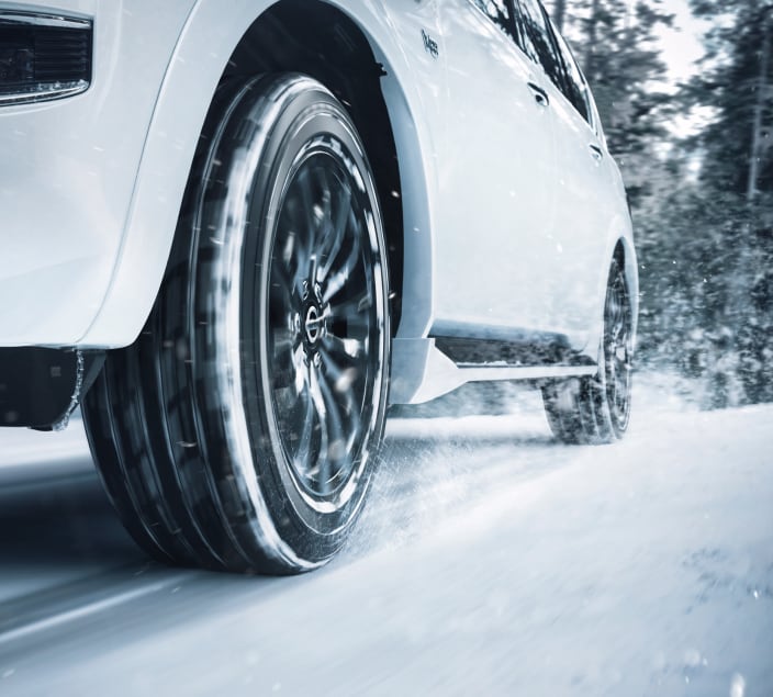 Nissan cars with Winter tyres driving through the snow
